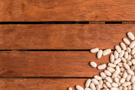 White Beans Frame over a wooden tableの写真素材