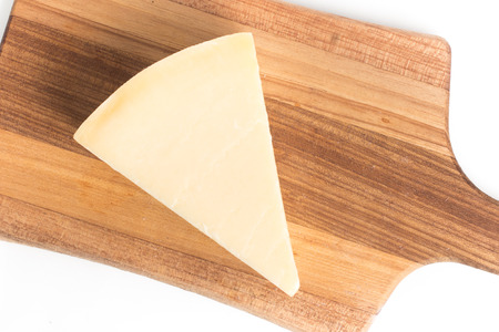 Peice of Parmesan Cheese isolated on white background