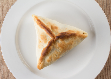 Arabic esfiha. Manakish over a wooden tableの写真素材