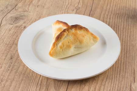 Arabic esfiha. Manakish over a wooden tableの写真素材