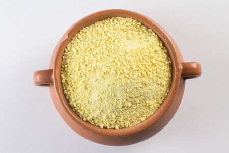 Yellow Manioc Flour over a white backgroundの写真素材