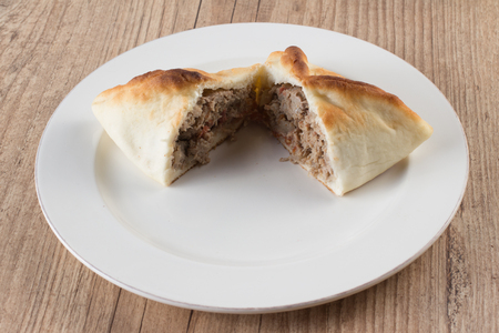 Arabic esfiha. Manakish over a wooden tableの写真素材