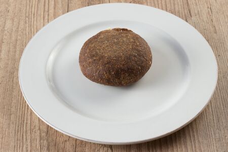 Arabic Kibbeh or Kibe over a wooden table