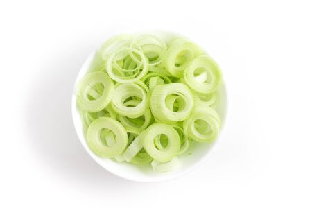 Sliced Leeks in a bowl isolated on white backgroundの写真素材