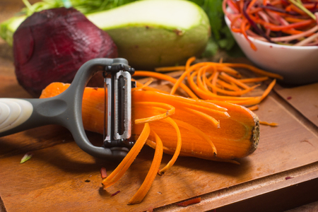 Spaghetti of Vegetables. Carrot, Zucchini and beet Noddles over a wooden tableの写真素材