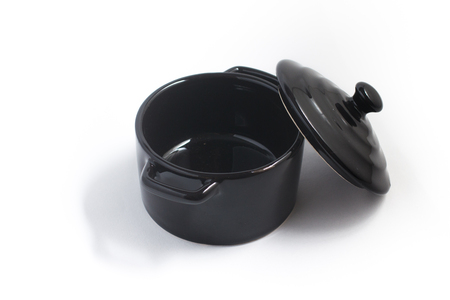 Empty black pan isolated on white backgroundの写真素材