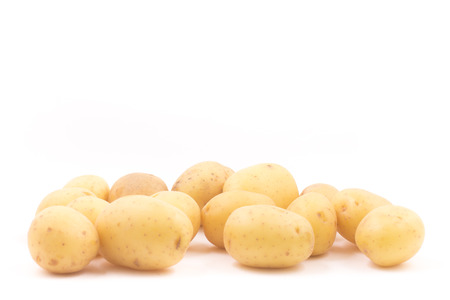 heap of baby potatoes on white backgroundの写真素材