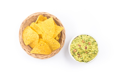 Pile of Tortillas. Nachos chips with guacamole isolated on white backgroundの写真素材