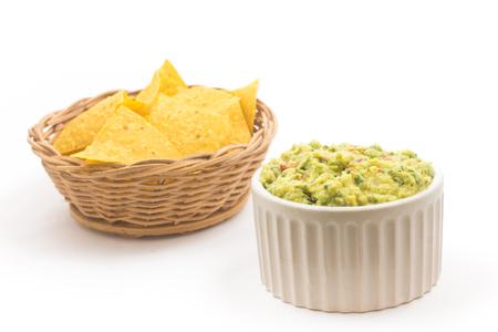 Pile of Tortillas. Nachos chips with guacamole isolated on white backgroundの写真素材