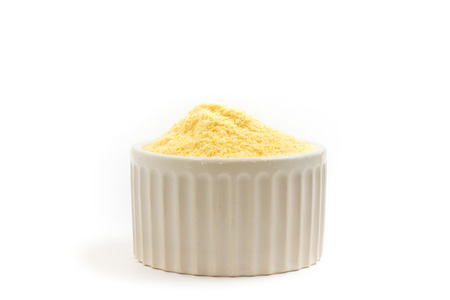 Brazilian Fuba. Corn Flour in a white bowl isolated on white background