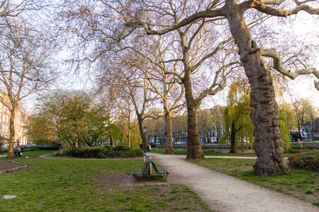 AMSTERDAM, NETHERLANDS - APRIL 14, 2019: Pleasant square and trees in Amsterdam, Netherlandsのeditorial素材