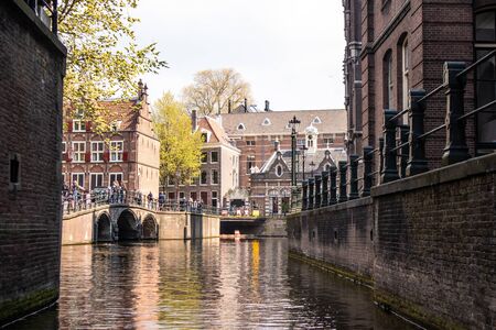 AMSTERDAM, NETHERLANDS - APRIL 14, 2019: Beautiful Houses on Amsterdam Canal, Netherlands.のeditorial素材