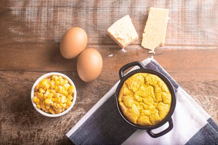 known as 'sufle de milho' in brazil over a wooden tableの写真素材