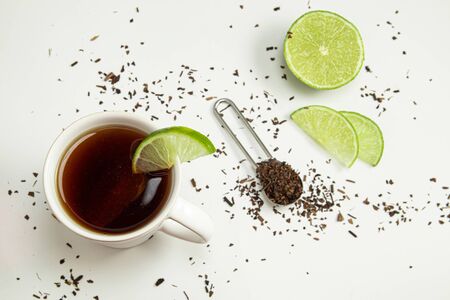 Cup of toasted Erva-Mate Tea with lemon on white backgroundの写真素材