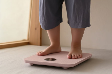 Barefoot woman in pajama standing on digital weight and body fat scales on bathroom floor in morning. Generative AI illustrationの素材