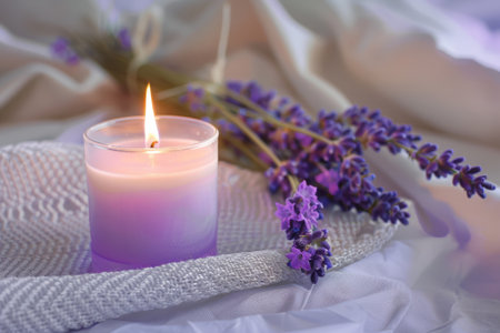 Aromatherapy concept. Violet scented candle with lavender flowers. Generative AI illustrationの素材