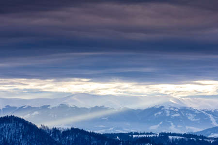 Mountain peak with snow blow by wind. Winter landscape. Cold day, with snow.の写真素材
