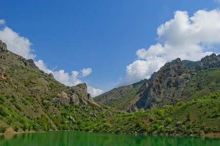 Beautiful sunny valley between the mountains with lush clouds in the Crimea, Ukraineの写真素材