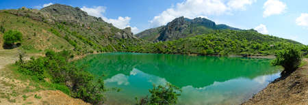 Beautiful sunny valley between the mountains with lush clouds in the Crimea, Ukraineの写真素材
