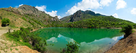 Beautiful sunny valley between the mountains with lush clouds in the Crimea, Ukraineの写真素材