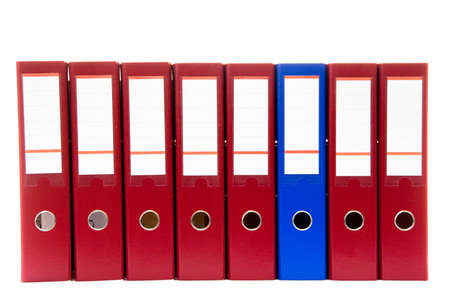 row of folders for papers and documentation on a shelf in the officeの写真素材