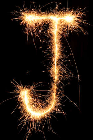 Burning Sparkling number 0 zero isolated on black background. Beautiful Glowing design element for greeting card, holiday flyer.の写真素材