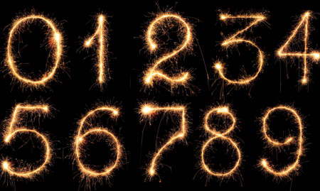 Burning Sparkling number 0 zero isolated on black background. Beautiful Glowing design element for greeting card, holiday flyer.の写真素材