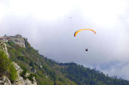 Enjoy the freedom with a paragliding flightの写真素材