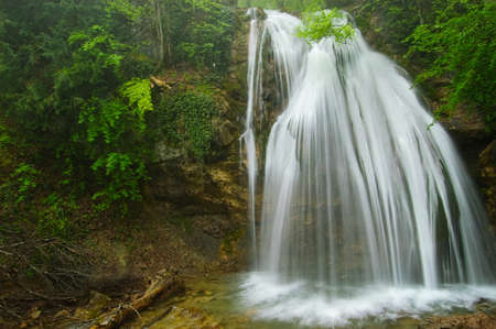 The Dzhur-Dzhur waterfall flows after heavy rain in the mountain range of the Crimean peninsula. The peninsula was annexed to the Russian Federation. Ukraine.の写真素材