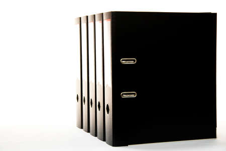 row of folders for papers and documentation on a shelf in the officeの写真素材