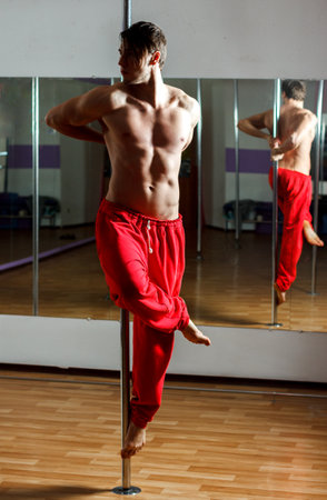 Ukrainian gymnast doing gymnastics with aerial hoop or aerial hoop in the fitness room.の写真素材