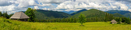 Beautiful nature and a wonderful landscape around a wooden hut, in a clearing located on the slopes of the Carpathian Mountains above Lake Synevyr. Ukraine.の写真素材