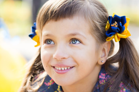 Flag Day of Independence of Ukraine. Stop WAR. Ukrainian girl in an embroidered vyshyvanka shirt with a yellow-blue flag of Ukraine. Symbols of the flag of Ukraine. Freedom. Russia terror. Kyiv.の写真素材