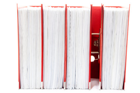 row of folders for papers and documentation on a shelf in the officeの写真素材