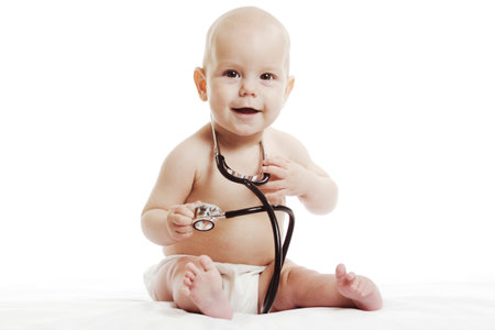 Infant child baby toddler sitting with medical stethoscope for physical therapy test isolated on a white backgroundの写真素材