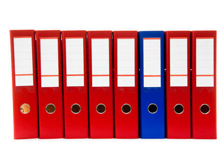 row of folders for papers and documentation on a shelf in the officeの写真素材