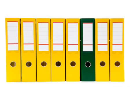 row of folders for papers and documentation on a shelf in the officeの写真素材