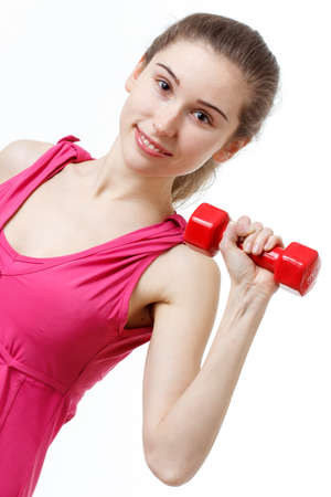 Fitness Workout. Sporty Woman Doing Bicycle Crunch Abs Exercise Lying On Floor Over Pink And Blue Neon Studio Background. Determined Lady Wearing White Fitwear Training Flexing Abdominal Musclesの写真素材