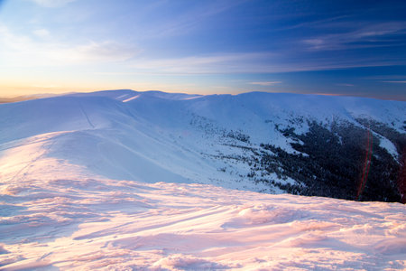 Snow covered mountains with blue sky in Carpathian mountains, Ukraine. Popular tourist attractionsの写真素材