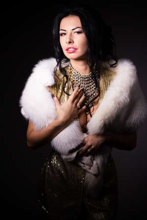 Portrait a beautiful woman in a golden gownの写真素材
