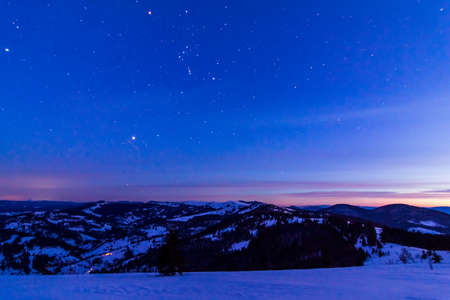The bright lights of the city streets in the background of the night sky. Panoramic view of residential areas.の写真素材