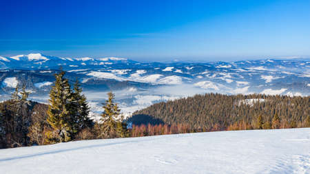 Mountain peak with snow blow by wind. Winter landscape. Cold day, with snow.の写真素材