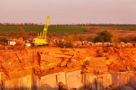 Top View of granite stone mine layers with heavy equipment insideの写真素材