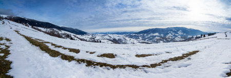 Mountain peak with snow blow by wind. Winter landscape. Cold day, with snow.の写真素材