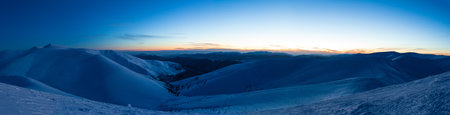Fantastic starry sky. Winter landscape and snow-capped peaks. Carpathian mountains. Ukraine. Europeの写真素材