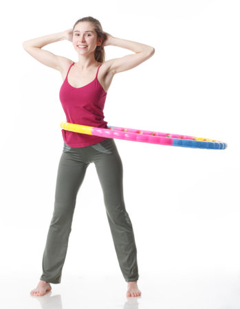 Fitness Workout. Sporty Woman Doing Bicycle Crunch Abs Exercise Lying On Floor Over Pink And Blue Neon Studio Background. Determined Lady Wearing White Fitwear Training Flexing Abdominal Musclesの写真素材