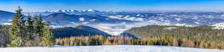 Mountain peak with snow blow by wind. Winter landscape. Cold day, with snow.の写真素材