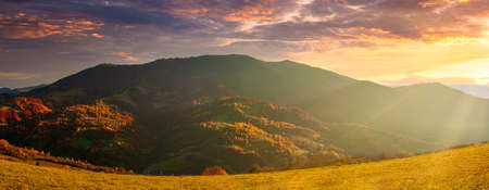 Ukraine. Warm autumn in a village. Picturesque beech, birch and pine forests and Hutsul houses...