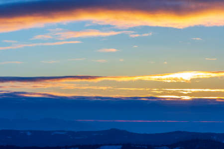 Dramatic sunset sky with clouds. Dramatic sunset over the seaの写真素材