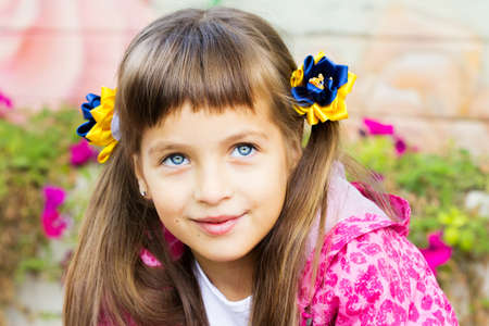 Happy laughing girl on grass. Smiling child outdoorsの写真素材